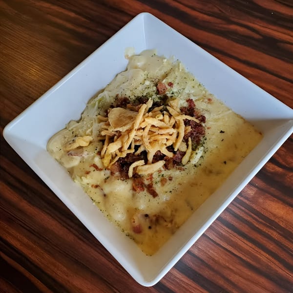 Elmwood Inn's creamy mac and cheese topped with crispy fried onions and bacon bits.